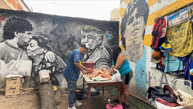 Volunteers at a Villa Fiorito, Buenos Aires soup kitchen in a house where late soccer legend Diego Armando Maradona spent his early childhood