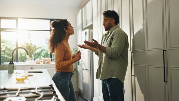 Argument, conflict and disagreement with couple in kitchen of home for blame, fault or resolution. Angry, fight and stress with unhappy people in apartment for discussion, frustration or mistake