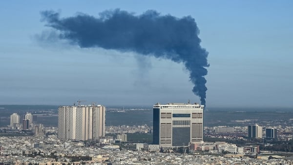 Smoke billows from an oil warehouse in the Kani Qirzhala area on the outskirts of Erbil, the capital of Iraq's autonomous Kurdistan region, following a suspected drone strike, on April 1, 2026. Iraq has been drawn into the broader Middle East war that sta