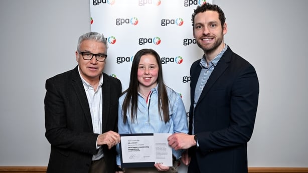 Waterford Camogie player Orla Hickey, centre, is presented with her certificate by GPA Legacy Leadership Programme Facilitator Martin Kelly, left, and GPA Chief Executive Tom Parsons during the GPA Legacy Leadership Programme Graduation ceremony at the Clayton Hotel Dublin Airport Central in Dublin.