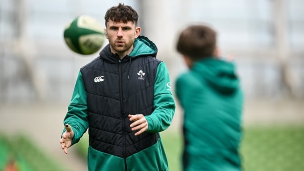 26 February 2026; Hugo Keenan, left, passes the ball with Luca Sexton, son of assistant coach Jonathan Sexton, during an Ireland Rugby open training session at the Aviva Stadium in Dublin. Photo by Shauna Clinton/Sportsfile