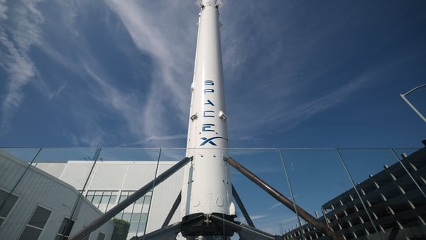 A SpaceX Falcon 9 rocket is displayed outside a Space Exploration Technologies Corp. facility in Hawthorne, California on March 26, 2026. SpaceX, the company founded by tech billionaire Elon Musk, will soon file for an initial public share offering in Jun