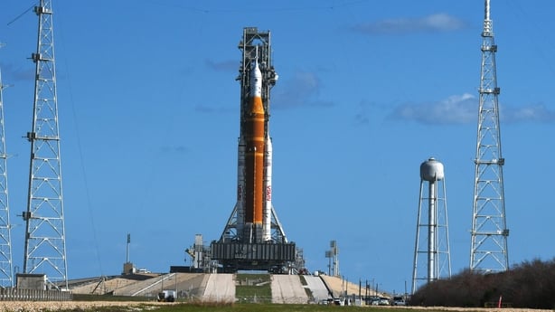The Artemis II Space Launch System (SLS) rocket with the Orion spacecraft stands at pad 39B after an 11-hour roll out from the Vehicle Assembly Building (VAB) where it had undergone repairs, at the Kennedy Space Center in March