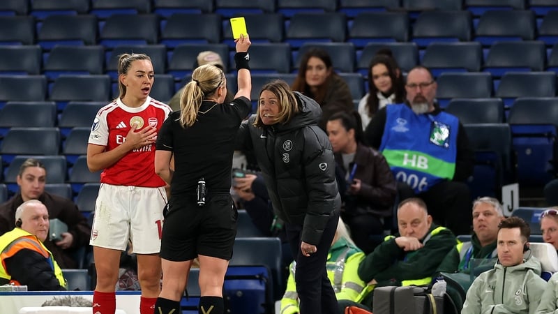 Referee Frida Mia Klarlund shows a yellow card to Sonia Bompastor, Manager of Chelsea, as Katie McCabe of Arsenal looks on during the UEFA Women's Champions League 2025/26 Quarter-finals Second Leg match between Chelsea and Arsenal at Stamford Bridge on A