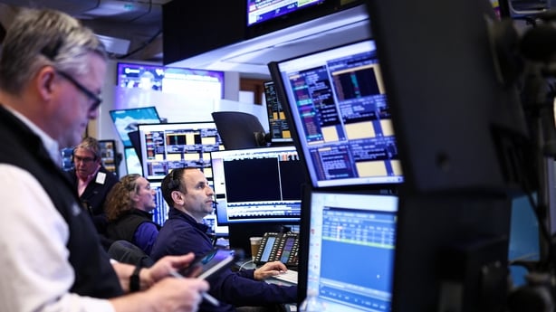 Traders work on the floor of the New York Stock Exchange (NYSE) at the opening bell in New York on April 2, 2026. Wall Street stocks tumbled early Thursday on the latest jump in oil prices as tough rhetoric between the United States and Iran lessened hopes of a Middle East war resolution. (