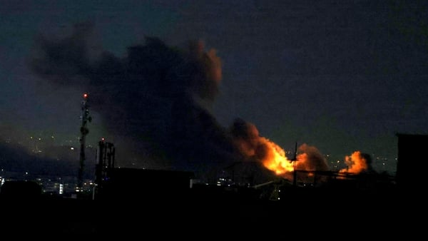 A plume of smoke rises from the site of a strike in Tehran on March 29, 2026.