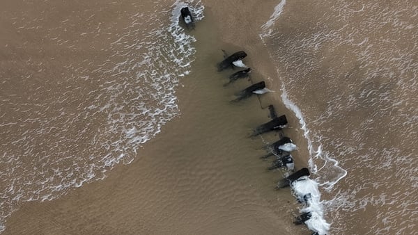 Part of a 200-year-old shipwreck is pictured in the sand on a Co Donegal beach
