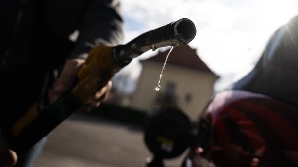 Drops of petrol fall from the nozzle of a petrol pump at a gas station in Mulhouse, eastern France