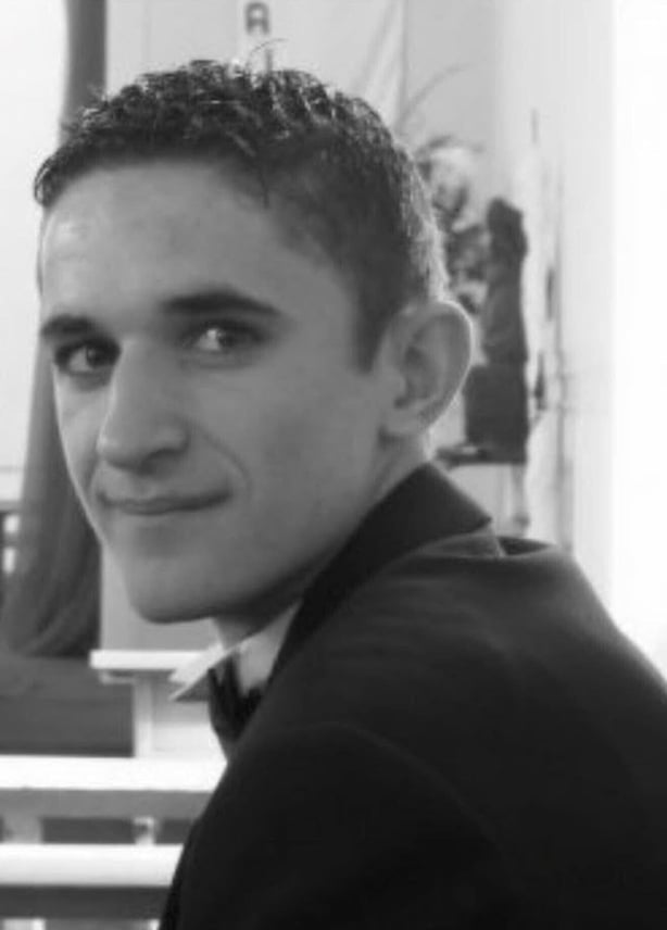 Black and white headshot of Darren Price