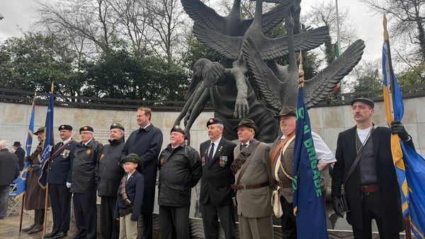 Jim O'Callaghan stands alongside attendees of the 196 Easter Rising commemoration in Dublin