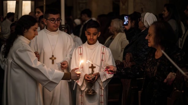 Catholic Christians celebrate Easter Saturday at thge Church of the Holy Sepulchre in Jerusalem