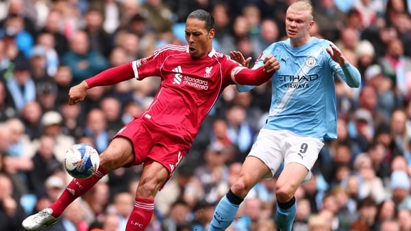 Virgil van Dijk of Liverpool is under pressure from Erling Haaland - 2026 FA Cup quarter-final