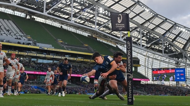 5 April 2026; Jimmy O'Brien of Leinster dives over to score his side's third try despite the attention of Charlie Shiel of Edinburgh during the Investec Champions Cup match between Leinster and Edinburgh at the Aviva Stadium in Dublin. Photo by Ramsey Cardy/Sportsfile