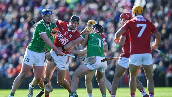 5 April 2026; Eoin Downey of Cork is put under pressure by Limerick players, from left, Shane O'Brien and Aidan O'Connor during the Allianz Hurling League Division 1A final match between Limerick and Cork at TUS Gaelic Grounds in Limerick. Photo by John S