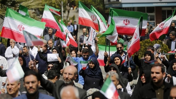 Doctors and medicine students carry Iranian flags and photos of healthcare workers who lost their lives in US-Israeli attacks, as they stage a protest at the premises of Imam Khomeini Hospital in Tehran, Iran on April 06, 2026. (Photo by Fatemeh Bahrami/A