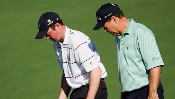 AUGUSTA, GA - APRIL 06: Amateur Brian McElhinney of Ireland gets advise from playing partner Tom Watson on where to drop his ball on the second hole during the first round of The Masters at the Augusta National Golf Club on April 6, 2006 in Augusta, Georg