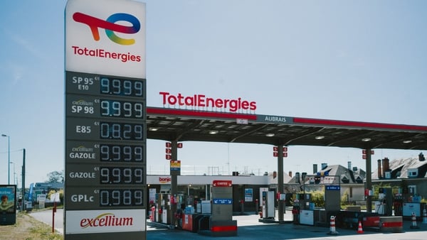 A view of the price board and forecourt at a TotalEnergies petrol station