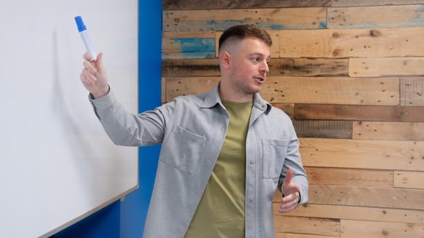 Séadhan De Poire from the Dublin Academy of Education at the whiteboard in class.