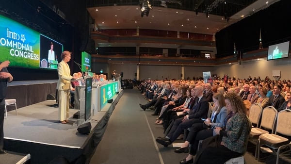 this photograph shows minister for education hildegarde naughton addressing delegates at an INTO congress