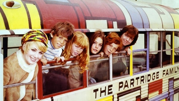 Shirley Jones, US actress and singer, Brian Forster, US actor, Suzanne Crough, US actress, Susan Dey, US actress, Danny Bonaduce, US actor, and David Cassidy, US actor and singer, pose leaning out of the windows of a bus in a group portrait issued as publ