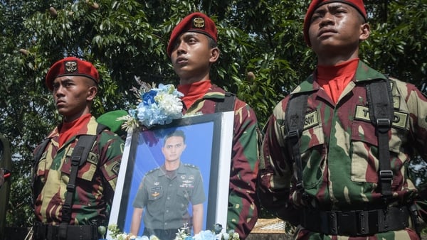 Indonesian soldiers take part in the funeral of fallen compatriot and UN peacekeeper Zulmi Aditya Iskandar