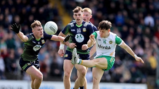 13 April 2025; Shane Tierney of Offaly kicks a point despite the efforts of Ruairí Kinsella of Meath during the Leinster GAA Football Senior Championship quarter-final match between Meath and Offaly at Pairc Tailteann in Navan, Meath. Photo by Thomas Flinkow/Sportsfile