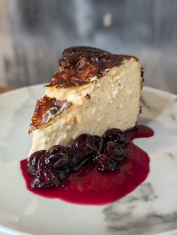 Eunice Power's burnt basque cheesecake with blueberry compote and cream
