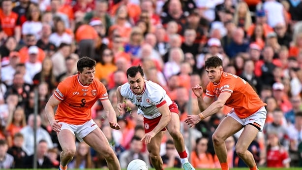 Darragh Canavan of Tyrone in action against Armagh players Callum O'Neill, left, and Darragh McMullan - 2025 Ulster SFC