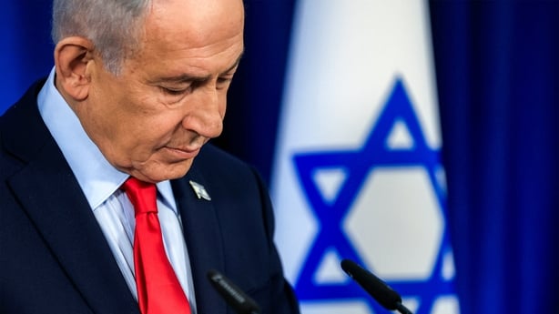 Israeli Prime Minister Benjamin Netanyahu looking down