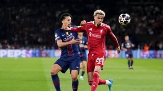 Paris Saint-Germain's Aoas Correa Marquinhos (left) and Liverpool's Hugo Ekitike