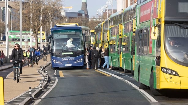 buses lined up on a city street
