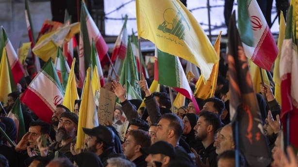 Pro-government demonstrators wave national flags and flags of Lebanon's Hezbollah during the funeral ceremony for Majid Khademi, head of Iran's IRGC Intelligence Organization, in Tehran, Iran, on April 8, 2026. This event takes place during a period of ceasefire between the Islamic Republic and the 