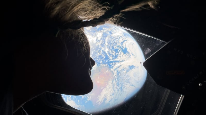 An image from inside the Artemis II looking back to Earth