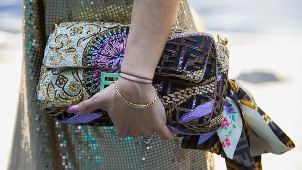 A statement bag is a good way to add interest to an otherwise understated outfit (Alamy/PA)