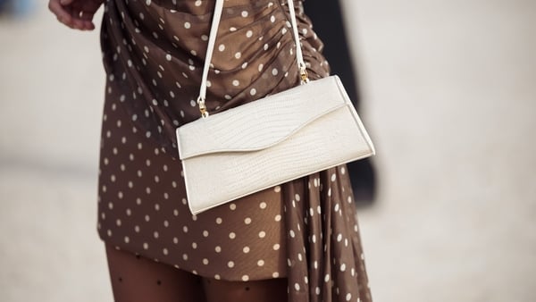 Simona Jakstaite close up of polkadot dress and white bag