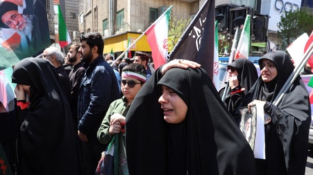 Iranians react during a rally to commemorate the death of the country's slain supreme leader Ayatollah Ali Khamenei in Tehran on April 9, 2026. Thousands of Iranians paid tribute on April 9 to the late supreme leader Ali Khamenei, who ruled the country for nearly four decades until his killing in US