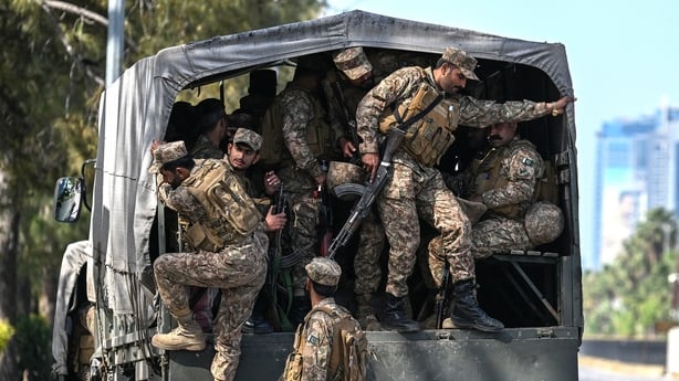 Pakistani army soldiers arrive for deployment at the Red Zone area of Islamabad