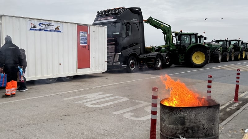 Fire burns in a barrel at a protest at Galway Port