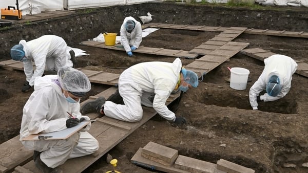 Forensic staff working under a tented enclosure - pic credit: ODAIT