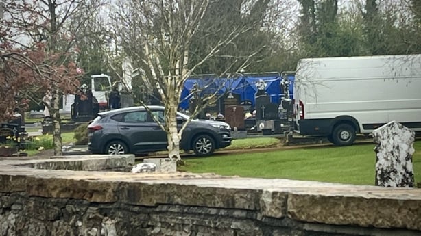 Vehicles and tents are pictured in a graveyard for the exhumation of the body of Leitrim man Liam Farrell 
