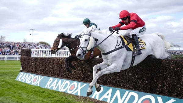 LIVERPOOL, ENGLAND - APRIL 10: Harry Skelton riding Grey Dawning (red) clear the last to win The JCB Melling Chase on Ladies Day at Aintree Racecourse on April 10, 2026 in Liverpool, England. (Photo by Alan Crowhurst/Getty Images)
