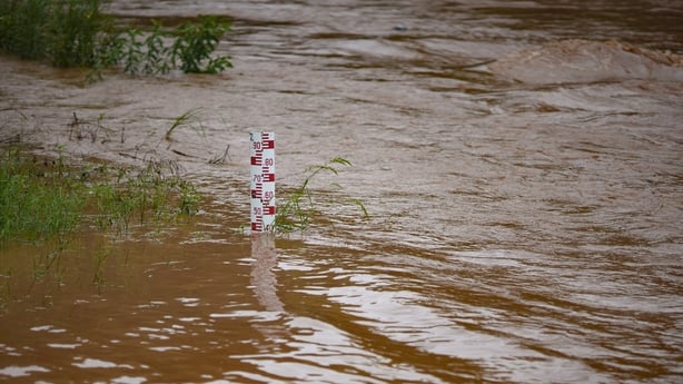 A flood measuring stick in a river 