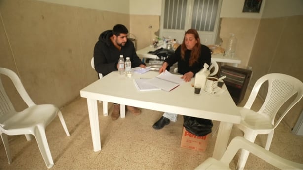 Omar Toni Azar is here with his mother and father, helping to run the shelter they have opened inside it.