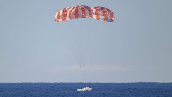 NASA’s Orion spacecraft with Artemis II crewmembers NASA astronauts Reid Wiseman, commander; Victor Glover, pilot; Christina Koch, mission specialist; and CSA (Canadian Space Agency) astronaut Jeremy Hansen, mission specialist aboard is seen as it lands i