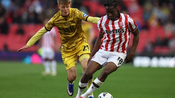 Bosun Lawal of Stoke City and Mathias Jorgensen of Blackburn Rovers in action during the Sky Bet Championship match between Stoke City and Blackburn Rovers at Bet365 Stadium on April 11, 2026 in Stoke on Trent, England. 