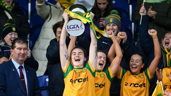 The Donegal captain Roisin Rodgers, 9, lifts the cup after the presentation by Mícheál Naughton, LGFA Management, following the 2026 Lidl National League Division 2 final between Cavan and Donegal at St Tiernach’s Park, Clones, Co. Monaghan.