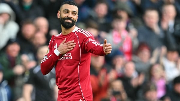Liverpool's Egyptian striker #11 Mohamed Salah celebrates after scoring their second goal during the English Premier League football match between Liverpool and Fulham at Anfield in Liverpool, north west England on April 11, 2026.