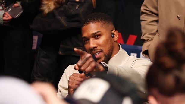 Anthony Joshua gestures towards Tyson Fury (not pictured) after the Heavyweight fight between Tyson Fury and Arslanbek Makhmudov at Tottenham Hotspur Stadium on April 11, 2026 in London, England.