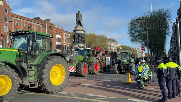 Tractors and trucks are pictured leaving Dublin’s O’Connell Street after a Garda operation