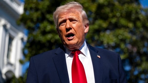 US President Donald Trump speaks to members of the media on the South Lawn of the White House